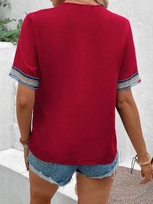 Deep Red V-neck blouse with embroidered trim on short sleeves
