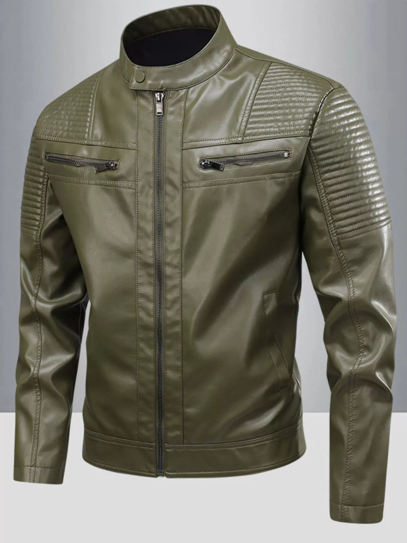 Plus-size green leather motorcycle jacket with quilted shoulder details and zippered pockets.