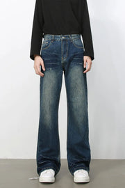 Faded wash flare jeans in dark blue denim with a relaxed fit and bootcut leg.