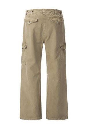 Distressed khaki utility wide-leg cargo pants with button flap pockets.