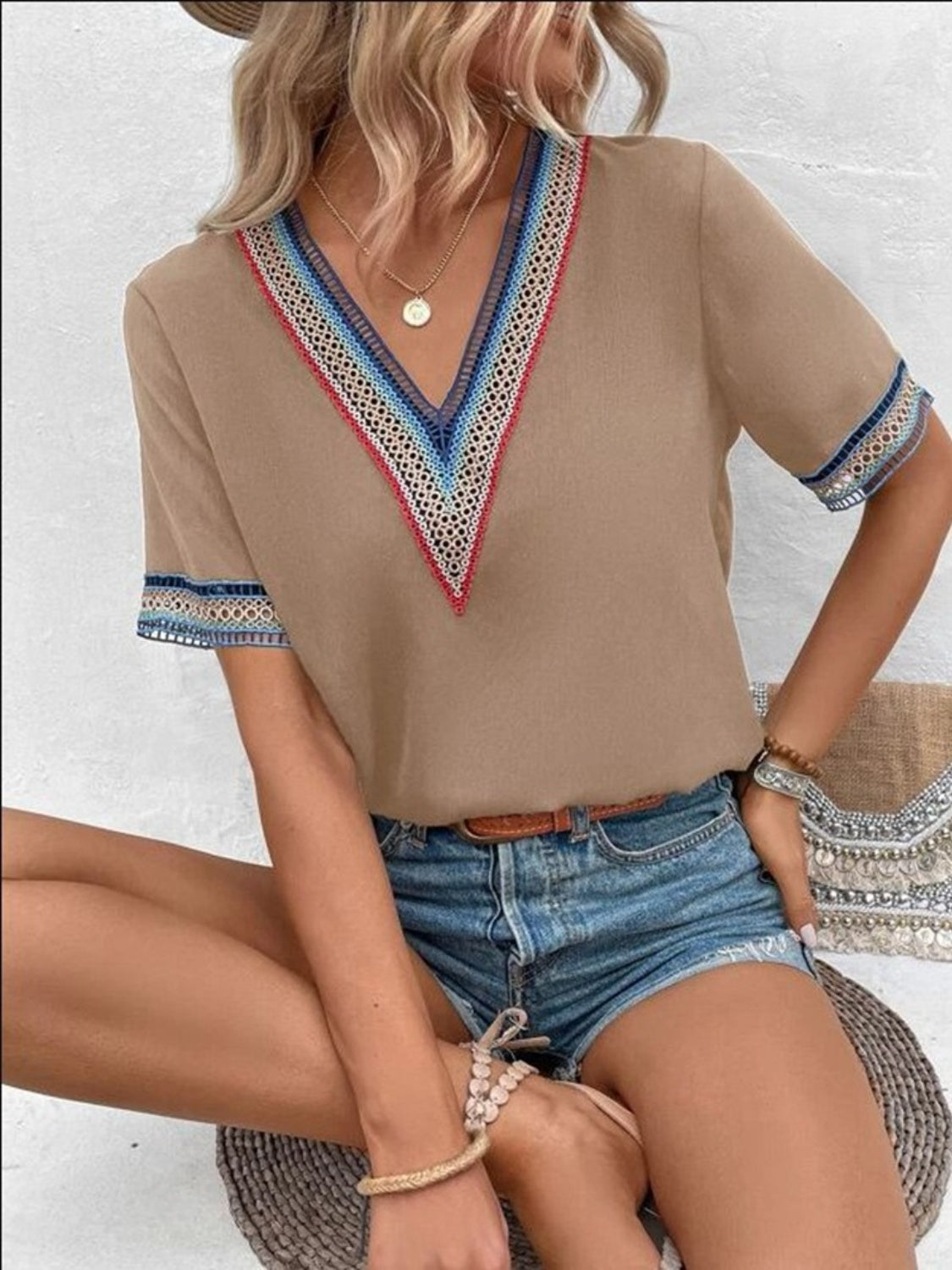 Mocha v-neck top with colorful embroidered trim on neckline and sleeves