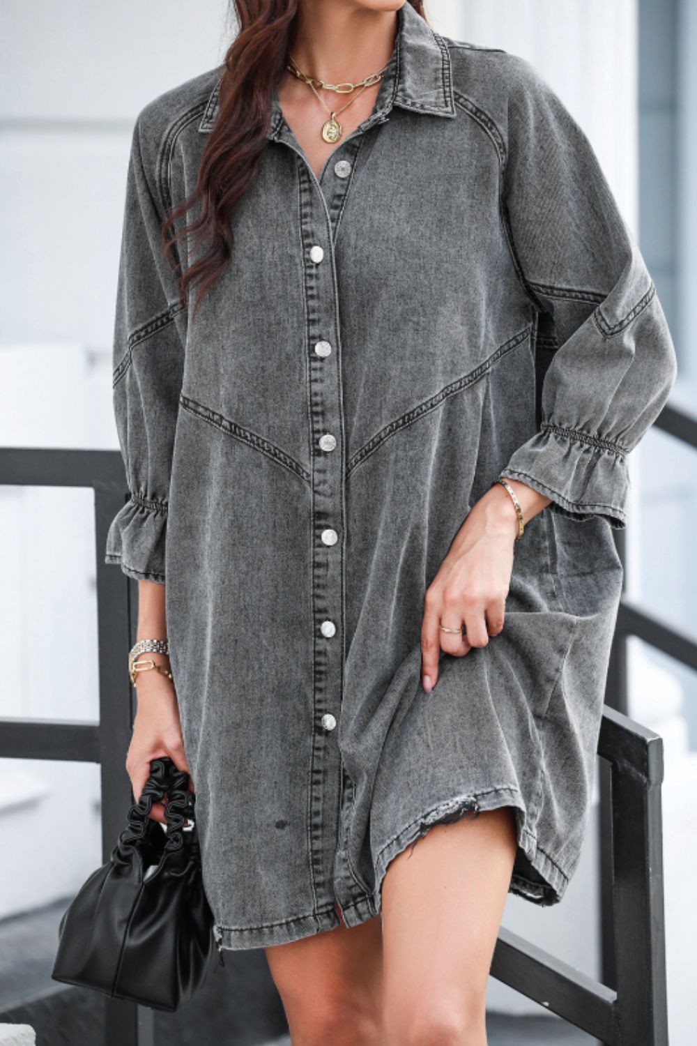 Gray denim shirtdress with button front and ruffled cuff detail.