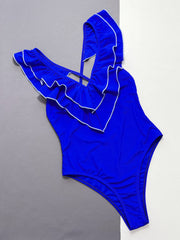Royal blue ruffled edge cross-back swimsuit with white trim detail.