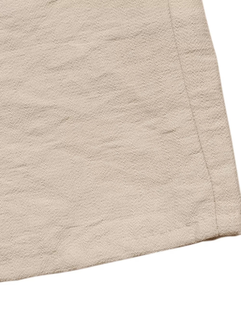 Beige textured midi dress fabric detail with tie-waist seam