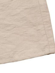 Beige textured midi dress fabric detail with tie-waist seam