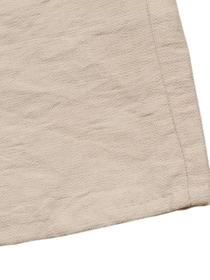 Beige textured midi dress fabric detail with tie-waist seam