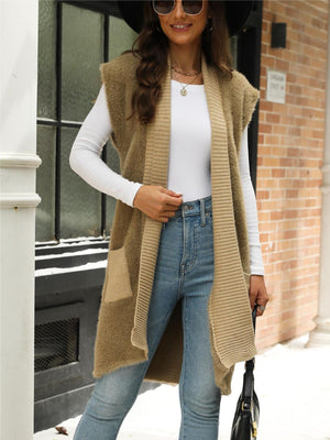 Tan textured knit sleeveless cardigan vest with ribbed trim and pockets.