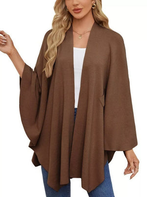 Caramel knit cape top with draped elegance and open front, worn over a white tank.