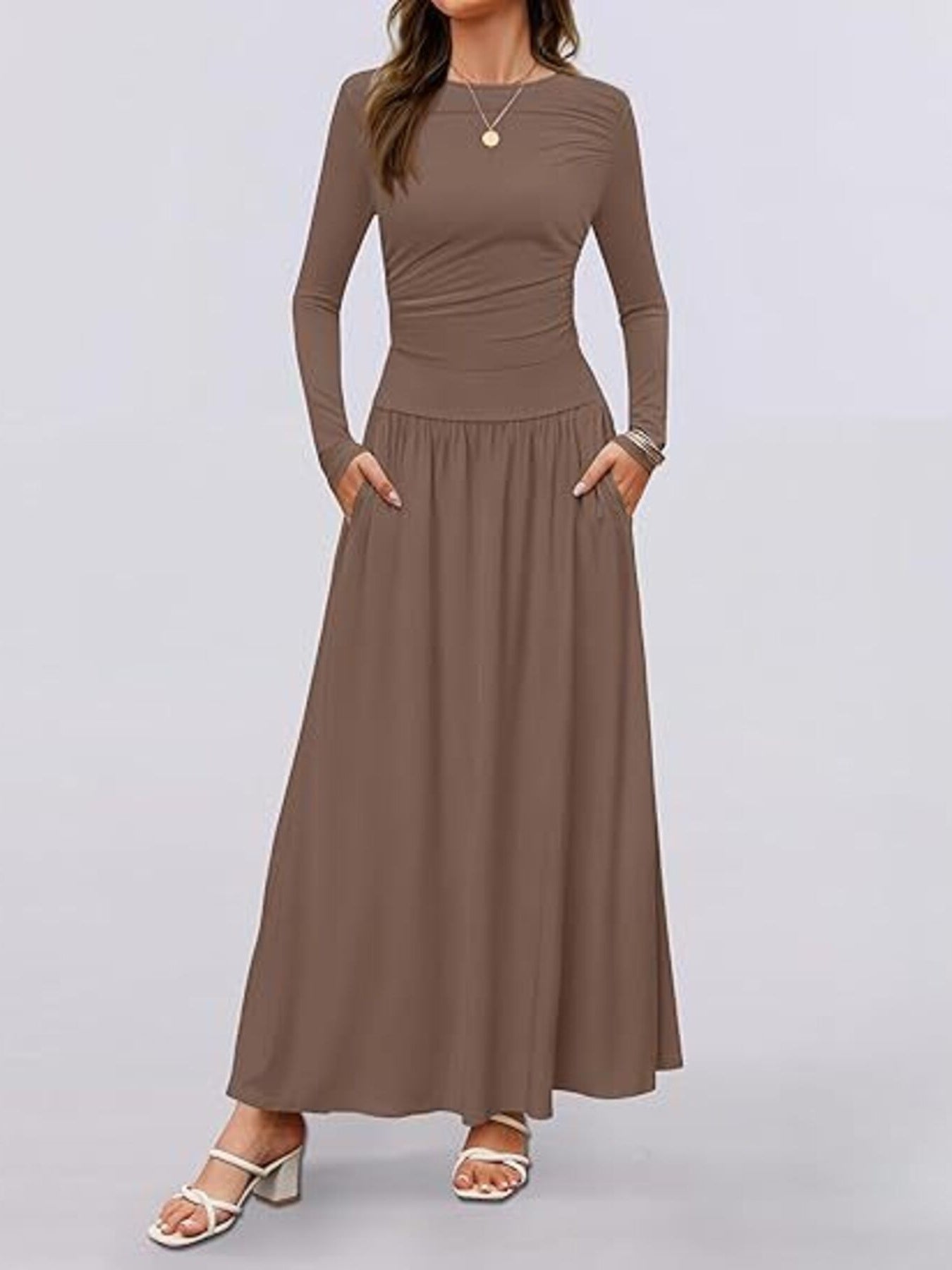 Elegant ruched maxi dress in coffee with long sleeves and pockets.