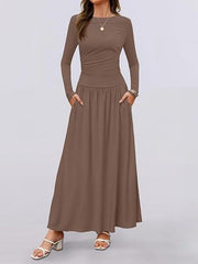 Elegant ruched maxi dress in coffee with long sleeves and pockets.