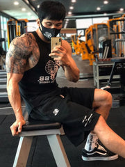 Black performance fleece jogger shorts with white logo detail.