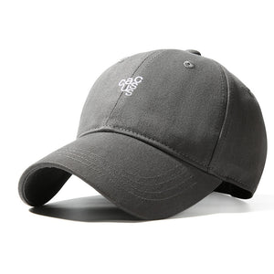 Grey baseball cap with curved brim and embroidered logo detail.