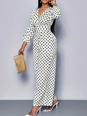 Chic white polka dot wide-leg jumpsuit with balloon sleeves and V-neck.