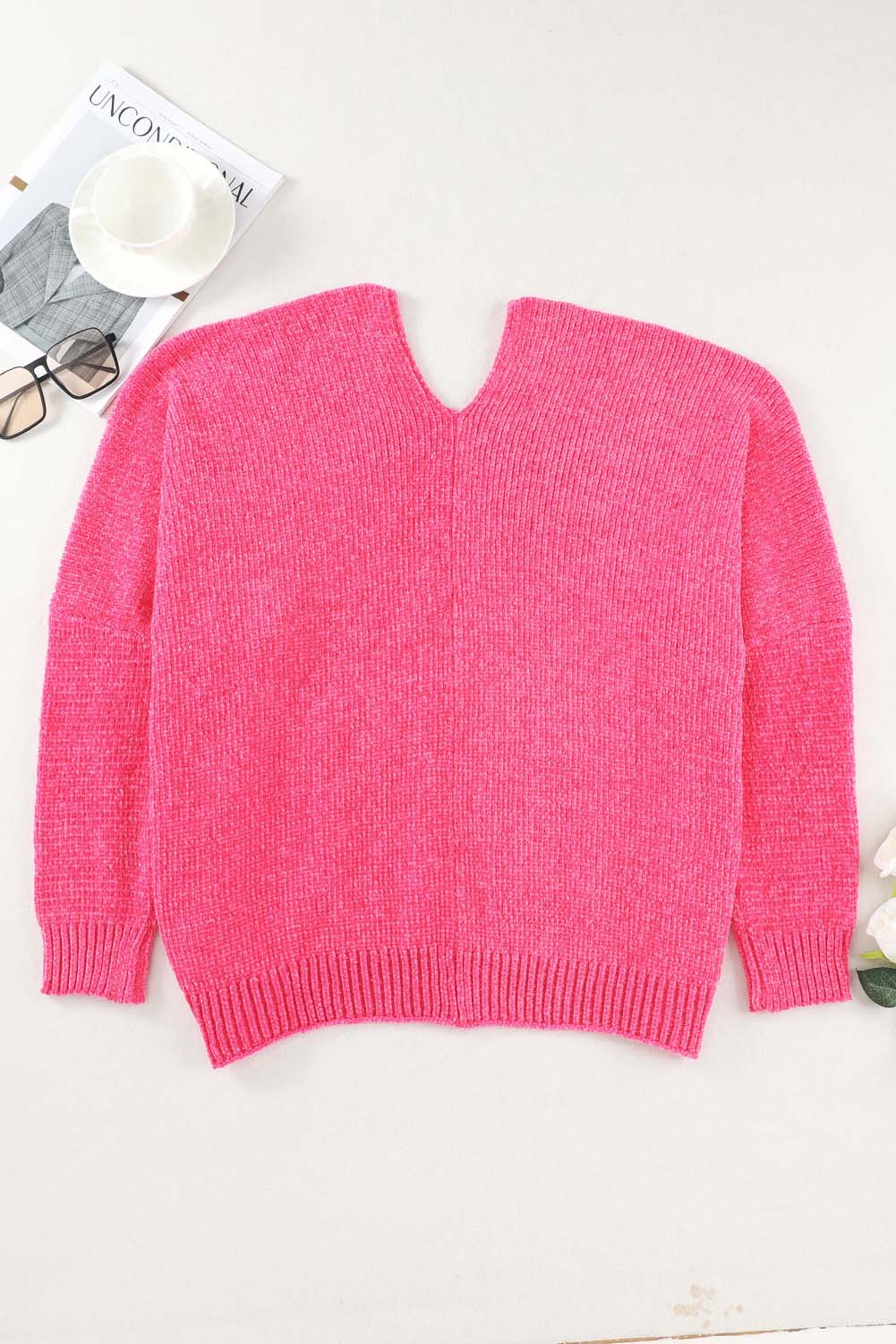 Plush pocket cardigan in hot pink with deep V-neck and ribbed cuffs and hem.