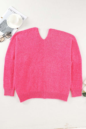 Plush pocket cardigan in hot pink with deep V-neck and ribbed cuffs and hem.