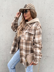 Oversized plaid shacket with attached hood in camel and white, featuring buttoned front and chest pockets.