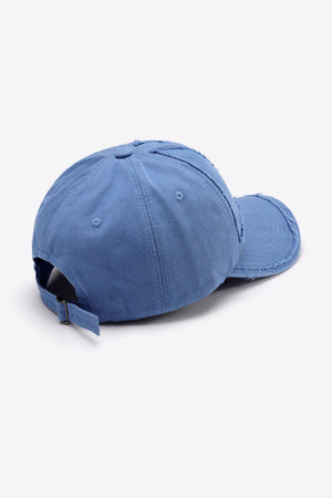 Raw edge denim baseball cap in Cobalt Blue with adjustable strap and distressed details.