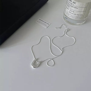 Sterling silver U-shaped pendant necklace with delicate snake chain.