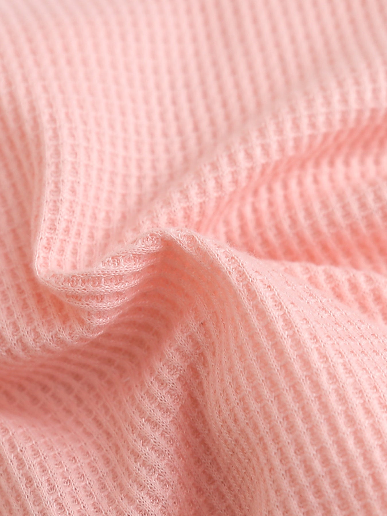 Pink waffle knit baby dress fabric detail