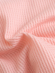 Pink waffle knit baby dress fabric detail