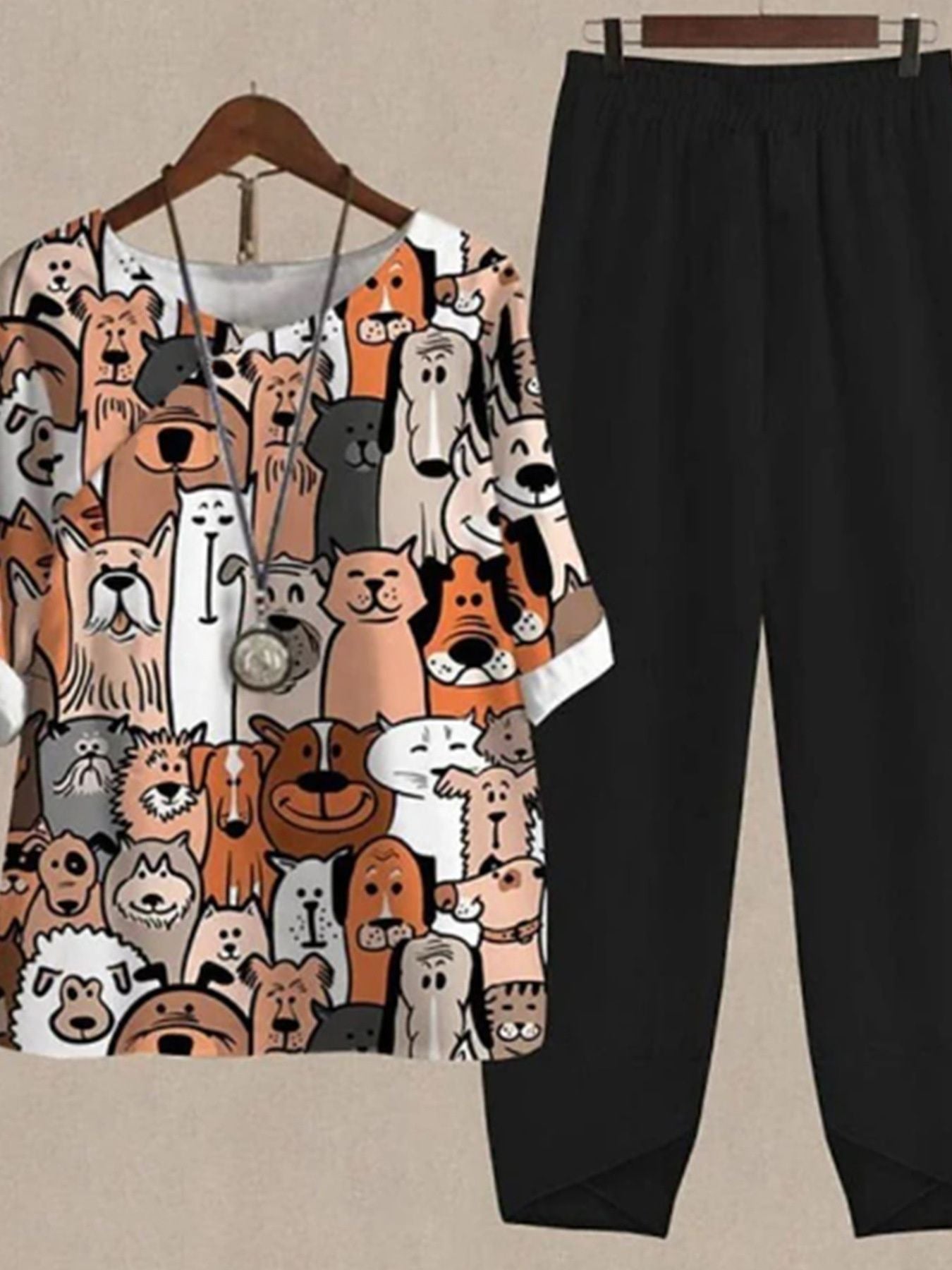 Women's black pants and a multicolor dog print half sleeve top set.