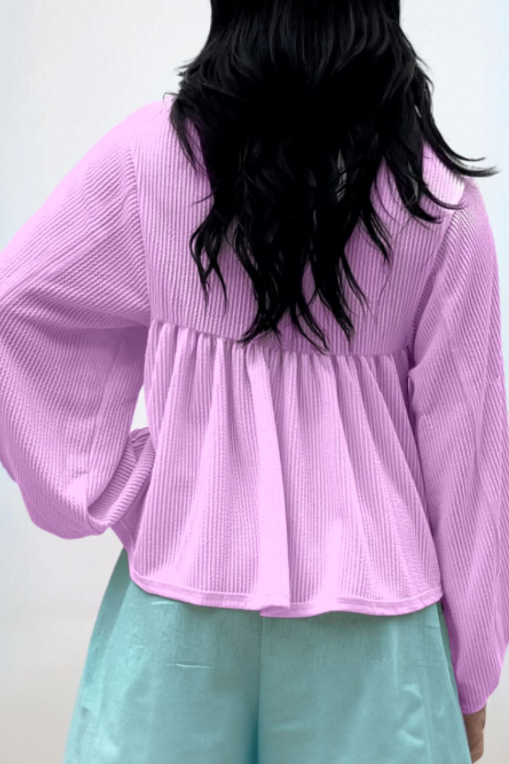 Lilac textured blouse with gathered yoke and balloon sleeves.