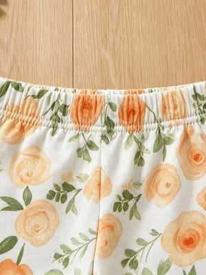 Baby floral pants with elastic waist in light yellow and pink watercolor roses.