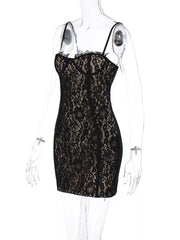 Black lace mini dress with spaghetti straps and scalloped trim neckline.