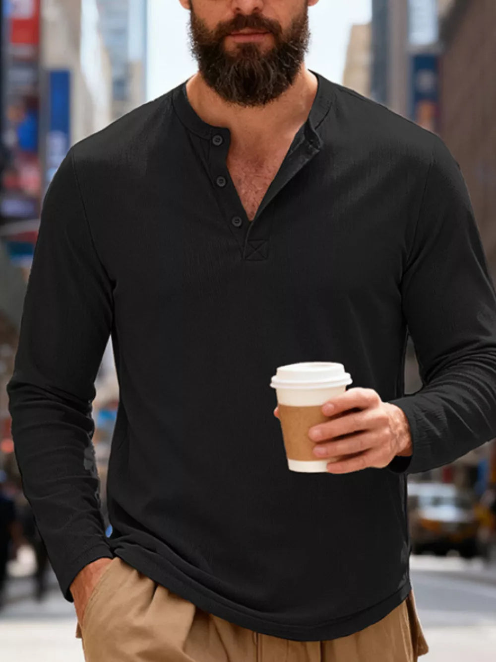 Men's black long sleeve cotton henley t-shirt with button placket.