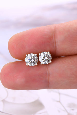Sterling silver moissanite solitaire stud earrings with four prongs.