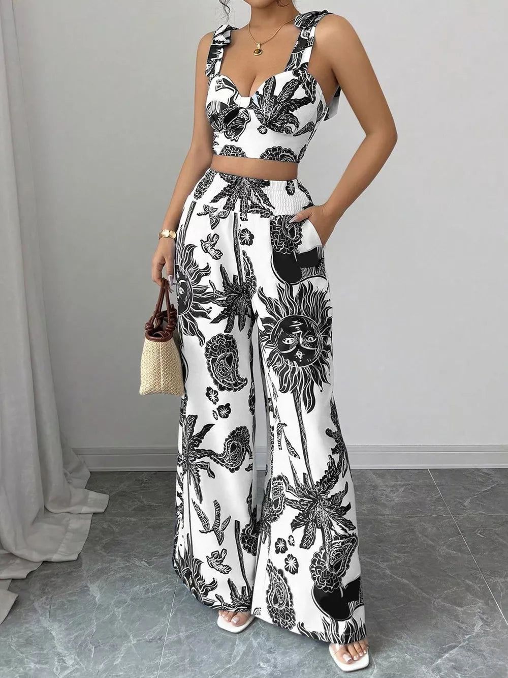 Tropical print crop top and wide-leg pants set with tie straps and smocked waist.