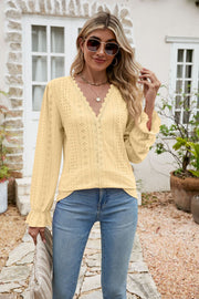 Light yellow eyelet lace blouse with ruffle sleeves and V-neckline