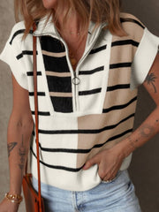 Colorblock ribbed zip polo with short sleeves and a quarter-zip neckline.