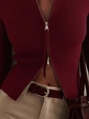 Burgundy ribbed zip-up cardigan with a silver zipper detail.