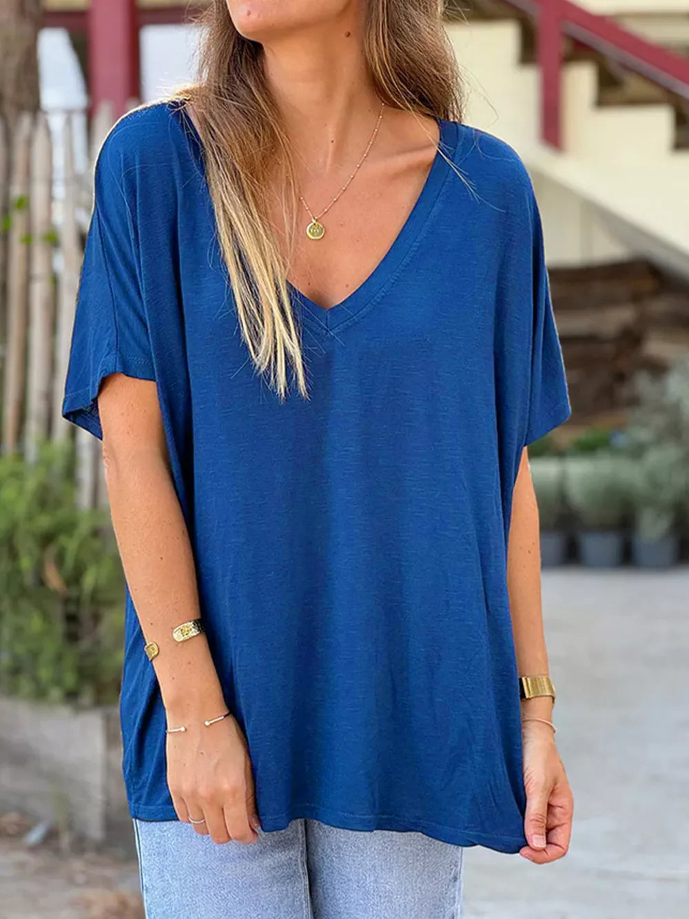 Blue relaxed fit V-neck t-shirt with short sleeves and a comfortable, casual style.