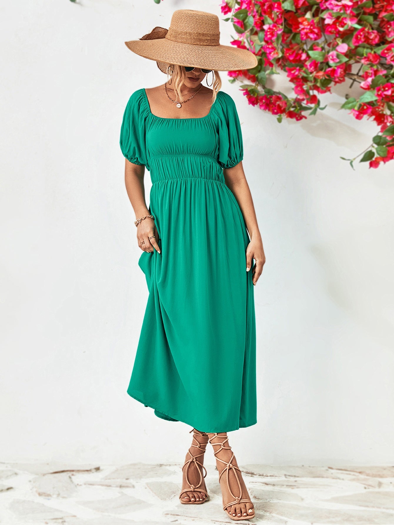 Green midi dress with gathered bodice, square neckline, puff sleeves, and A-line skirt.