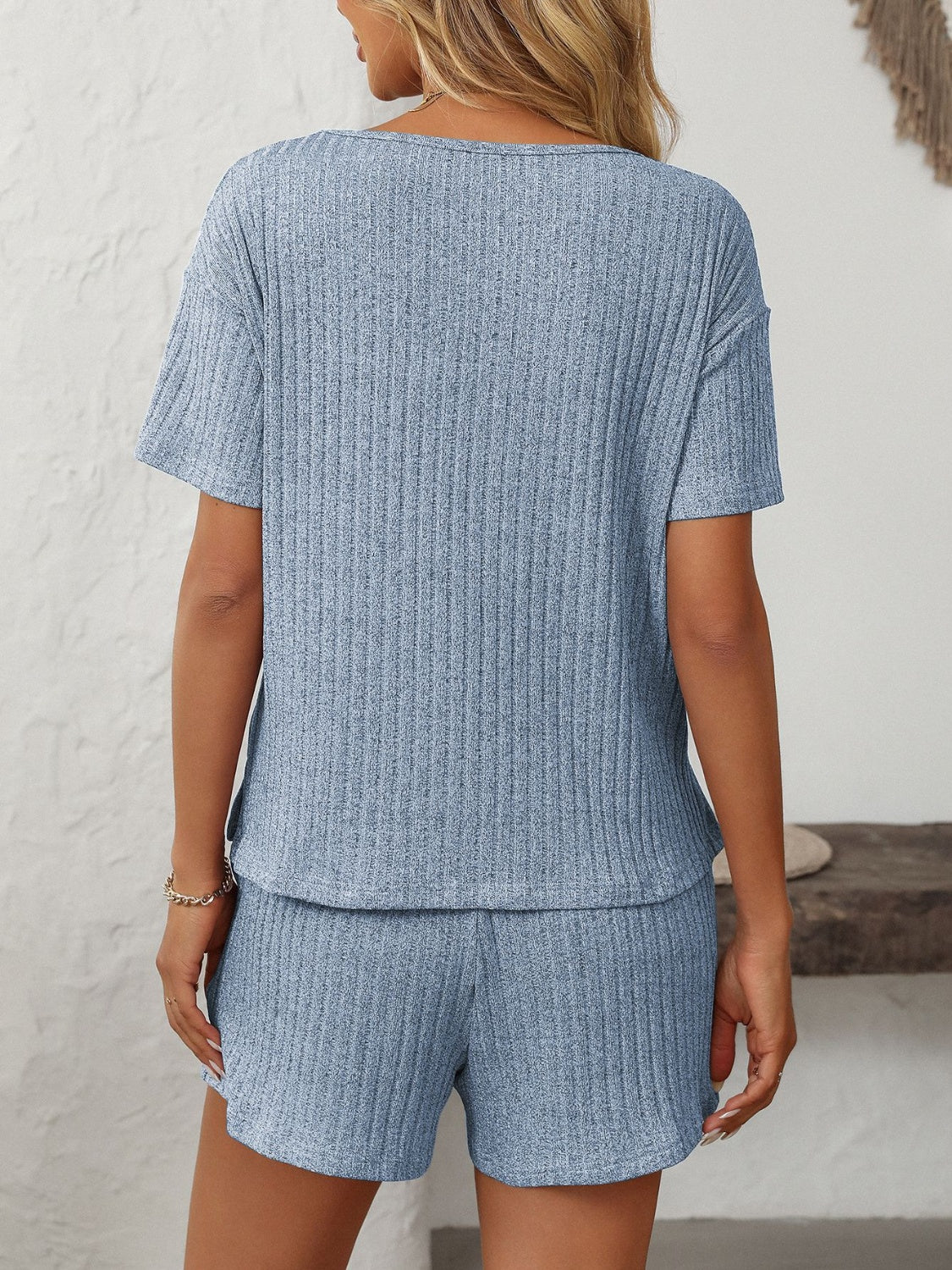 Light blue ribbed V-neck loungewear set with short sleeves and shorts.