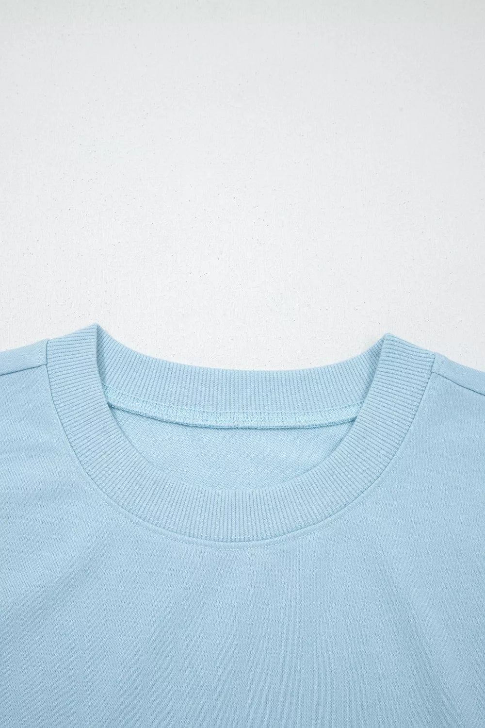 Light blue cotton crew neck sweatshirt with ribbed collar detail
