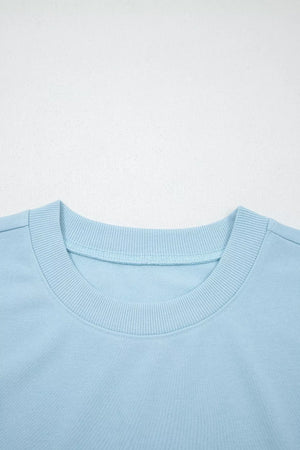 Light blue cotton crew neck sweatshirt with ribbed collar detail