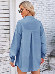 Oversized denim overshirt in dusty blue with a back pleat detail.