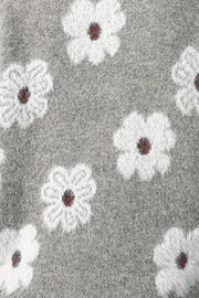 Gray acrylic sweater with white floral intarsia pattern and mock neck detail.