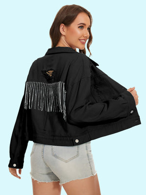Black distressed denim trucker jacket with crystal fringe detail and ripped back.