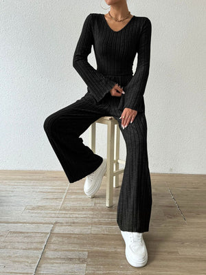 Black ribbed knit loungewear set with flared sleeves and wide-leg pants.