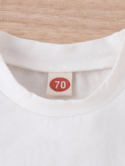 White baby t-shirt with size 70 tag