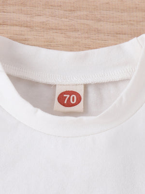 White baby t-shirt with size 70 tag