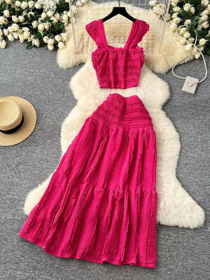 Textured rose red ruffled crop top and tiered maxi skirt set with square neckline and ruffled straps.