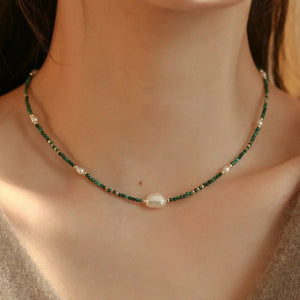 Elegant freshwater pearl and malachite beaded necklace with gold accents.