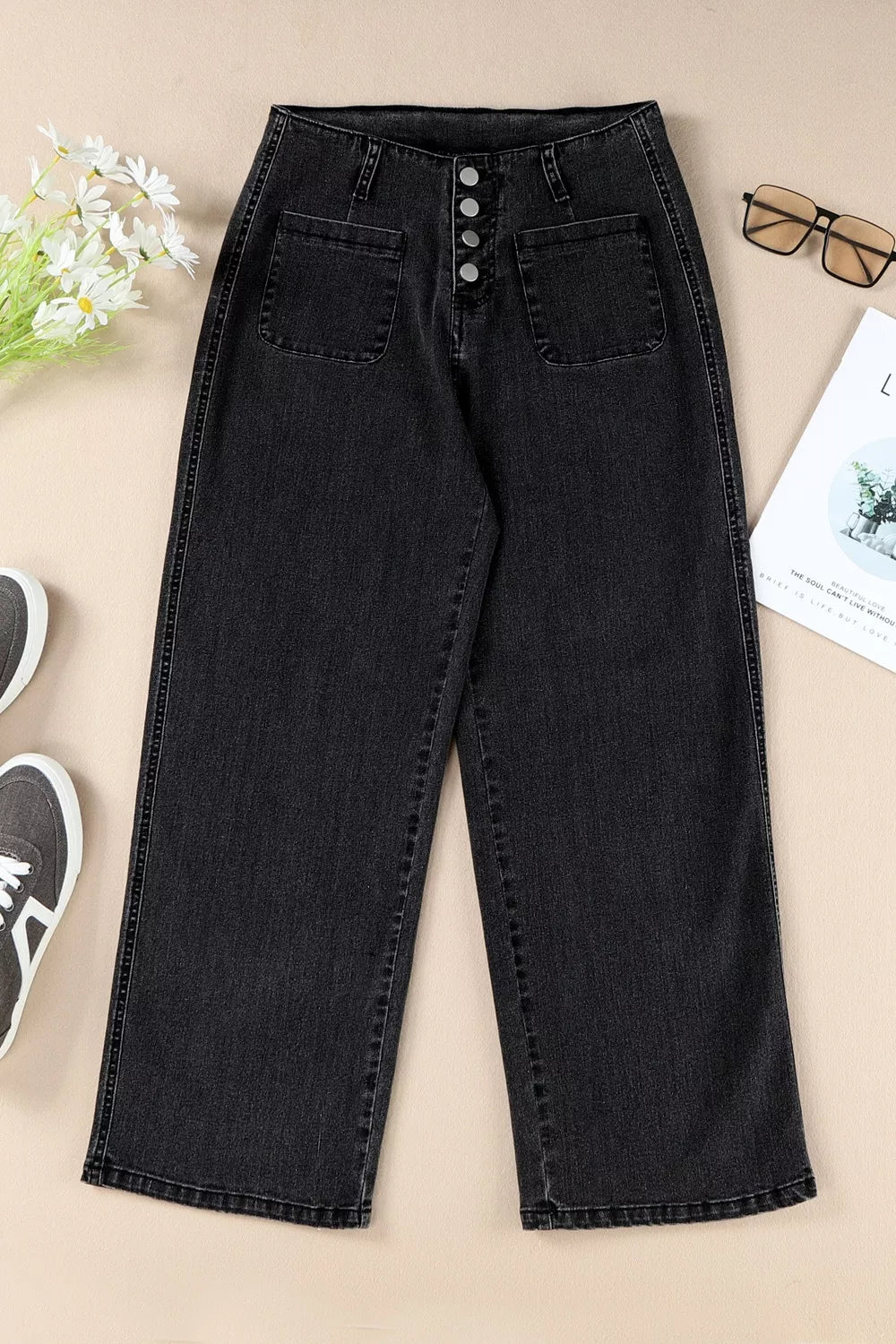 Black denim wide-leg jeans with button-fly and front patch pockets.