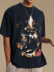 Black oversized t-shirt with abstract fiery graphic print.