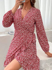 Red floral wrap mini dress with long sleeves and a V-neckline.